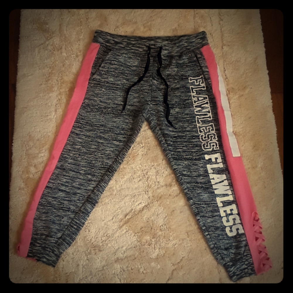 Grey and pink sweat pants with flawless on it